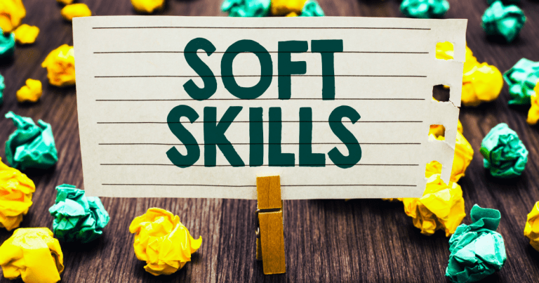 yellow and green paper balls surrounding a small sign that reads "soft skills"